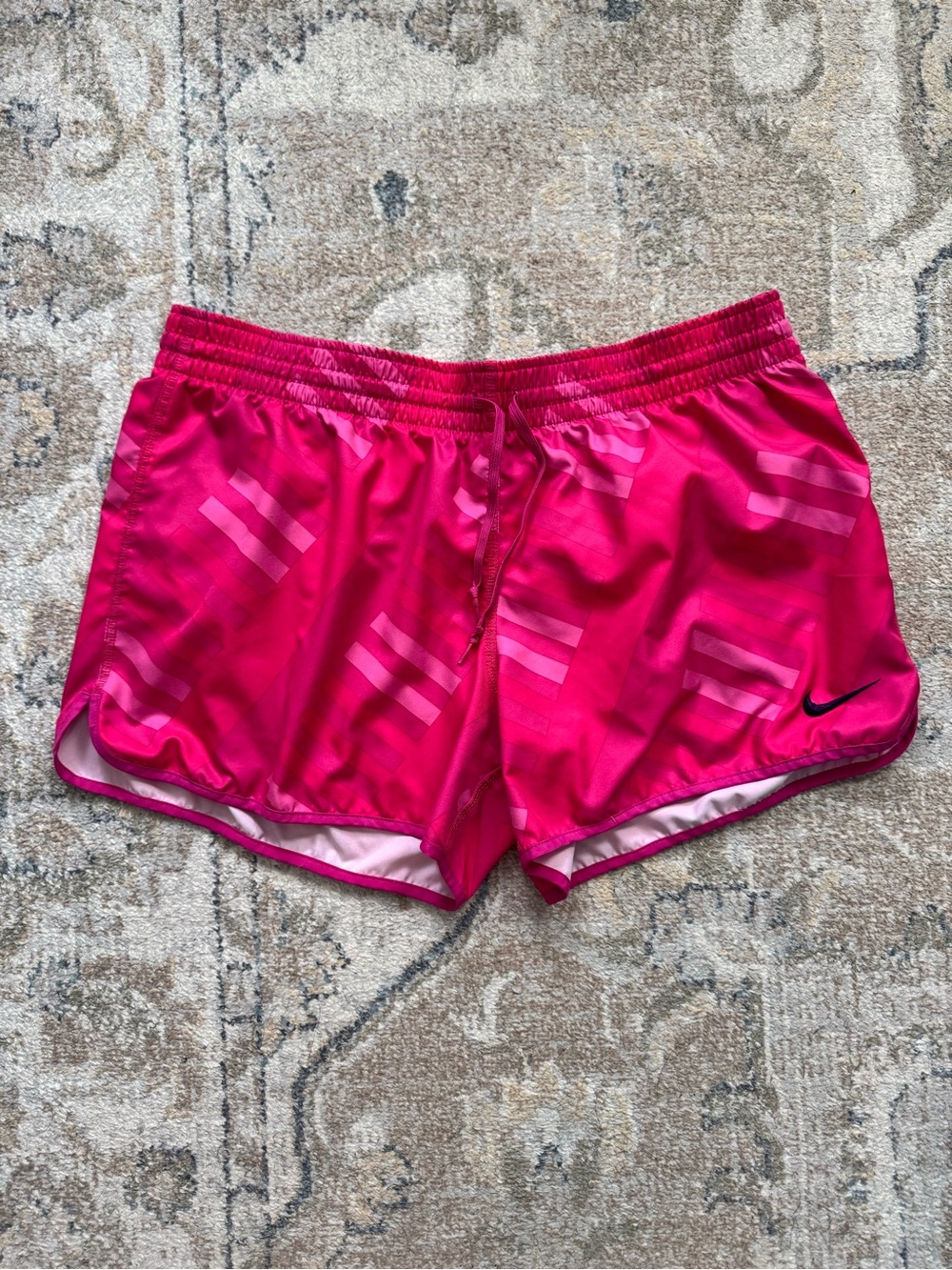 Nike Women's Bright Pink Athletic Shorts with Subtle Stripe Detail